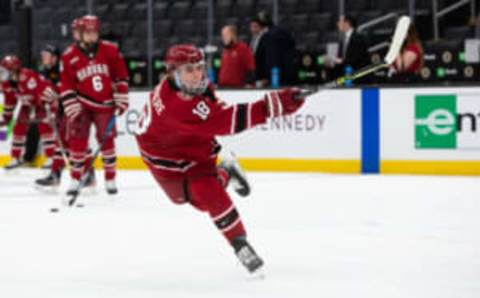 BOSTON, MA – FEBRUARY 7: Alex Laferriere #18 of the Harvard Crimson shoots the puck before a game against the Boston University Terriers during NCAA hockey in the semifinals of the annual Beanpot Hockey Tournament at TD Garden on February 7, 2022 in Boston, Massachusetts. (Photo by Richard T Gagnon/Getty Images)