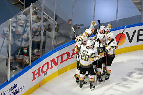 Alex Tuch #89 of the Vegas Golden Knights is congratulated by his teammates after scoring the game-winning goal against the Colorado Avalanche during overtime in a Western Conference Round Robin game. (Photo by Jeff Vinnick/Getty Images)