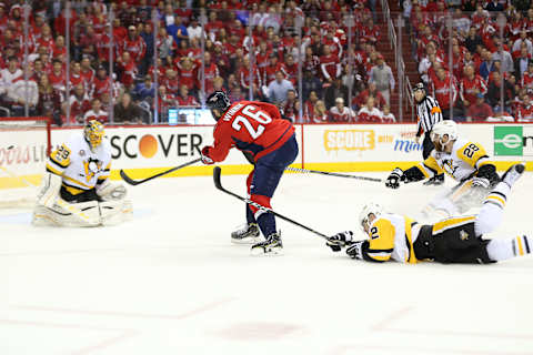 May 10, 2017; Washington, DC, USA; Washington Capitals right wing Daniel Winnik (26) attempts to shoot the puck past Pittsburgh Penguins goalie Marc-Andre Fleury (29) as Penguins defenseman Chad Ruhwedel (2) and Penguins defenseman Ian Cole (28) defend during the first period in game seven of the second round of the 2017 Stanley Cup Playoffs at Verizon Center. Mandatory Credit: Geoff Burke-USA TODAY Sports