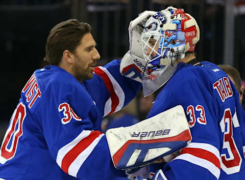 Dec 21, 2014; New York, NY, USA; New York Rangers goalie Henrik Lundqvist (30) congratulates goalie Cam Talbot (33) after shutting out the Carolina Hurricanes at Madison Square Garden. The Rangers defeated the Hurricanes 1-0. Mandatory Credit: Adam Hunger-USA TODAY Sports