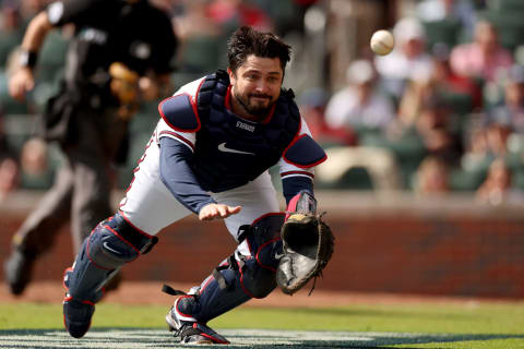 ATLANTA, GEORGIA – OCTOBER 11: Travis d’Arnaud #16 of the Atlanta Braves fails to make a catch on a bunt from Kyle Schwarber #12 of the Philadelphia Phillies during the fourth inning in game one of the National League Division Series at Truist Park on October 11, 2022 in Atlanta, Georgia. (Photo by Patrick Smith/Getty Images)