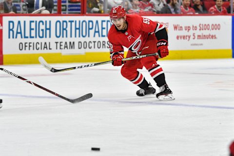 RALEIGH, NC – NOVEMBER 07: Carolina Hurricanes Defenceman Roland McKeown (55) passes the puck during a game between the Florida Panthers and the Carolina Hurricanes at the PNC Arena in Raleigh, NC on November 7 2017. Carolina defeated Florida 3-1. (Photo by Greg Thompson/Icon Sportswire via Getty Images)