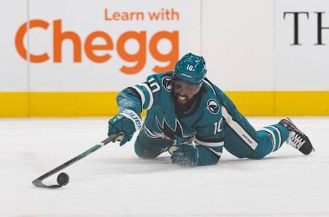 Nov 24, 2023; San Jose, California, USA; San Jose Sharks left wing Anthony Duclair (10) reaches for the puck during the second period against the Montreal Canadiens at SAP Center at San Jose. Mandatory Credit: Stan Szeto-USA TODAY Sports