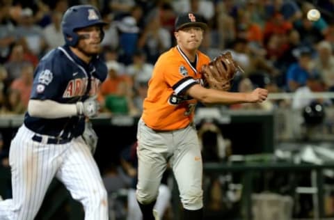 Jun 20, 2016; Omaha, NE, USA; Oklahoma State Cowboys pitcher Tyler Bufffett (37) throws out Arizona Wildcats outfielder Zach Gibbons (23) in the sixth inning in the 2016 College World Series at TD Ameritrade Park. Oklahoma State defeated Arizona 1-0. Mandatory Credit: Steven Branscombe-USA TODAY Sports