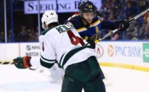 Oct 13, 2016; St. Louis, MO, USA; St. Louis Blues left wing Alexander Steen (20) delivers a check to Minnesota Wild defenseman Mike Reilly (4) during the second period at Scottrade Center. Mandatory Credit: Billy Hurst-USA TODAY Sports