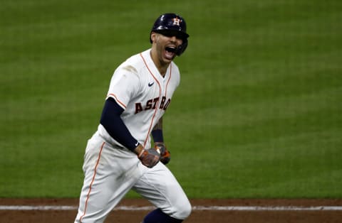 HOUSTON, TEXAS – OCTOBER 15: Carlos Correa #1 of the Houston Astros reacts as he rounds the bases after he hit a home run in the seventh inning against the Boston Red Sox during Game One of the American League Championship Series at Minute Maid Park on October 15, 2021 in Houston, Texas. (Photo by Bob Levey/Getty Images)