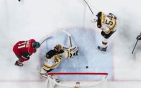 Nov 17, 2016; Saint Paul, MN, USA; Minnesota Wild forward Mikael Granlund (64) deflects the puck off Boston Bruins defenseman Adam McQuaid (54) and scores in the third period at Xcel Energy Center. The Minnesota Wild beat the Boston Bruins 1-0. Mandatory Credit: Brad Rempel-USA TODAY Sports