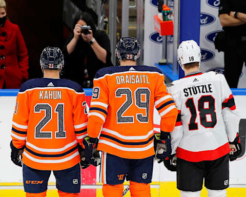 German players Edmonton Oilers forward Leon Draisaitl (29) and forward Dominik Kahun (21) and Ottawa Senators forward Tim Stuetzle (18) Mandatory Credit: Perry Nelson-USA TODAY Sports