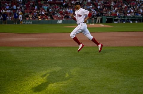 BOSTON, MA – JULY 11: Mookie Betts #50 of the Boston Red Sox warms up before a game against the Texas Rangers on July 11, 2018 at Fenway Park in Boston, Massachusetts. (Photo by Billie Weiss/Boston Red Sox/Getty Images)