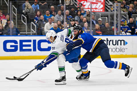 Mar 28, 2023; St. Louis, Missouri, USA; St. Louis Blues defenseman Robert Bortuzzo (41) is called for holding as he defends against Vancouver Canucks center Dakota Joshua (81) during the first period at Enterprise Center. Mandatory Credit: Jeff Curry-USA TODAY Sports