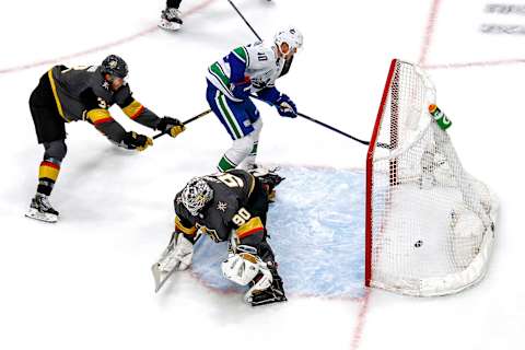 Elias Pettersson #40 of the Vancouver Canucks scores a goal past Robin Lehner #90 of the Vegas Golden Knights during the second period in Game Two of the Western Conference Second Round (Photo by Bruce Bennett/Getty Images)