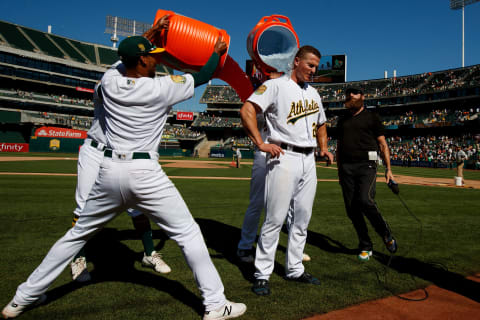 OAKLAND, CA – JULY 22: Matt Chapman #26 of the Oakland Athletics has Gatorade poured on him by teammates after hitting a walk off RBI single after the game against the San Francisco Giants at the Oakland Coliseum on July 22, 2018 in Oakland, California. The Oakland Athletics defeated the San Francisco Giants 6-5 in 10 innings. (Photo by Jason O. Watson/Getty Images)