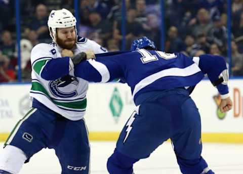 Dec 22, 2015; Tampa, FL, USA; Tampa Bay Lightning left wing Mike Angelidis (10) and Vancouver Canucks right wing Brandon Prust (9) fight during the first period at Amalie Arena. Mandatory Credit: Kim Klement-USA TODAY Sports