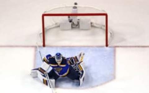 May 23, 2016; St. Louis, MO, USA; St. Louis Blues goalie Jake Allen (34) makes a glove save against the San Jose Sharks during the third period in game five of the Western Conference Final of the 2016 Stanley Cup Playoffs at Scottrade Center. The Sharks won the game 6-3. Mandatory Credit: Billy Hurst-USA TODAY Sports