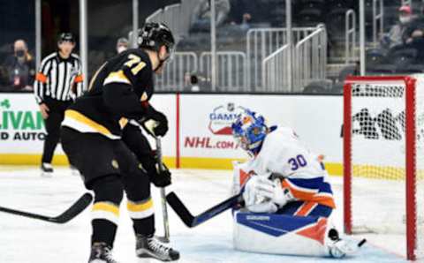 Apr 16, 2021; Boston, Massachusetts, USA; Boston Bruins left wing Taylor Hall (71) tips the puck past New York Islanders goaltender Ilya Sorokin (30) for a goal during the second period at TD Garden. Mandatory Credit: Bob DeChiara-USA TODAY Sports