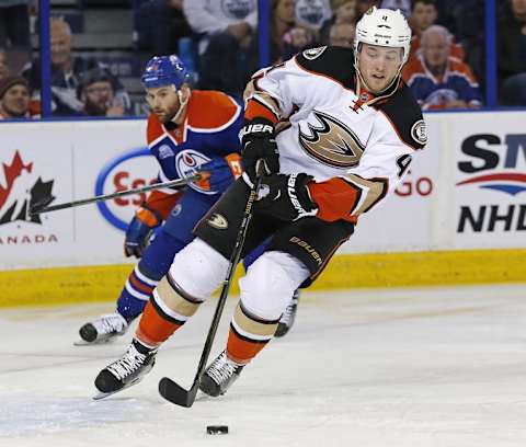 Mar 28, 2016; Edmonton, Alberta, CAN; Anaheim Ducks defensemen Cam Fowler (4) carries the puck out the defensive zone against the Edmonton Oilers during the first period at Rexall Place. Mandatory Credit: Perry Nelson-USA TODAY Sports