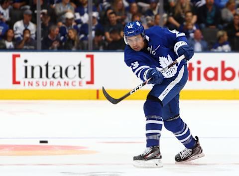 TORONTO, ON - SEPTEMBER 28: Cody Ceci #83 of the Toronto Maple Leafs passes the puck during an NHL pre-season game against the Detroit Red Wings at Scotiabank Arena on September 28, 2019 in Toronto, Canada. (Photo by Vaughn Ridley/Getty Images)