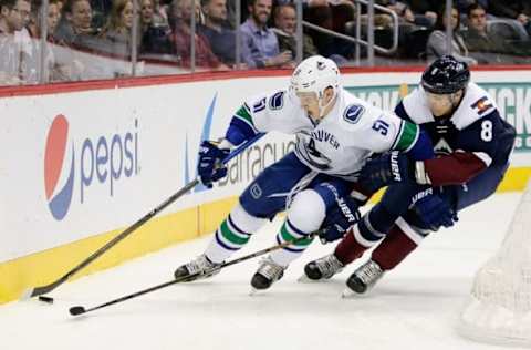 NHL Power Rankings: Vancouver Canucks defenseman Troy Stecher (51) controls the puck under pressure from Colorado Avalanche center Joe Colborne (8) in the second period at the Pepsi Center. Mandatory Credit: Isaiah J. Downing-USA TODAY Sports