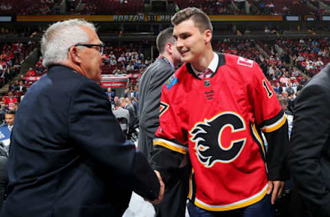 CHICAGO, IL – JUNE 24: Adam Ruzicka meets with executives after being selected 109th overall by the Calgary Flames during the 2017 NHL Draft at the United Center on June 24, 2017 in Chicago, Illinois. (Photo by Bruce Bennett/Getty Images)