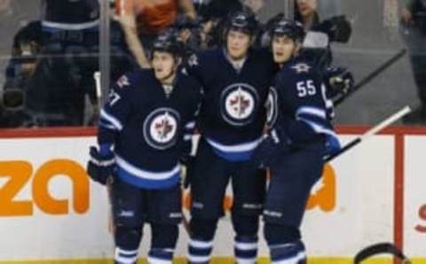 NHL Power Rankings: Winnipeg Jets right wing Patrik Laine (29) celebrates with teammates after scoring a goal during the second period against the Colorado Avalanche at MTS Centre. Mandatory Credit: Bruce Fedyck-USA TODAY Sports