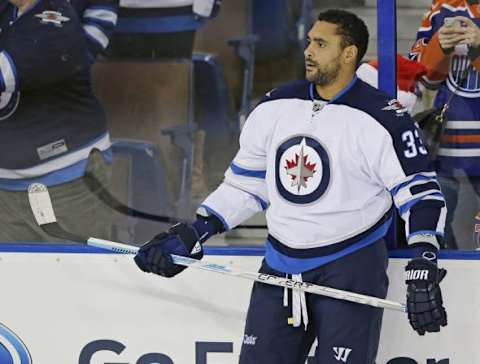 Dec 21, 2015; Edmonton, Alberta, CAN; Winnipeg Jets defensemen Dustin Byfuglien (33) skates on the ice during warmup prior to the game against the Edmonton Oilers at Rexall Place. Mandatory Credit: Perry Nelson-USA TODAY Sports