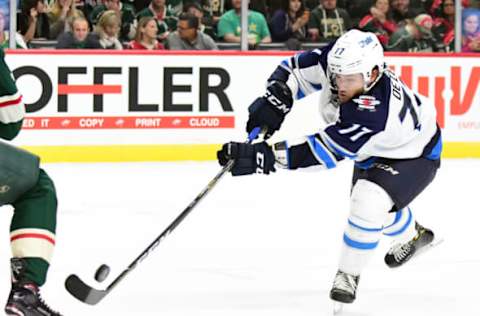 MINNEAPOLIS, MN: Winnipeg Jets center Chase De Leo (77) takes a shot during a preseason NHL game between the Minnesota Wild and Winnipeg Jets on September 21, 2017. (Photo by Nick Wosika/Icon Sportswire via Getty Images)