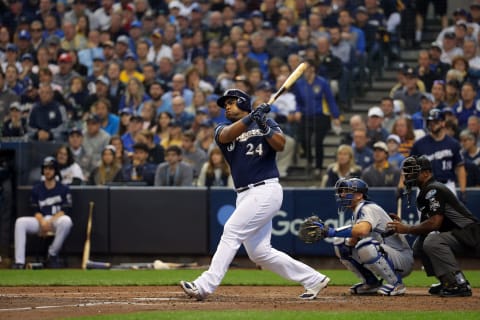 MILWAUKEE, WI – OCTOBER 13: Jesus Agguilar #24 of the Milwaukee Brewers singles during Game 2 of the NLCS against the Los Angeles Dodgers at Miller Park on Saturday, October 13, 2018 in Milwaukee, Wisconsin. (Photo by Alex Trautwig/MLB Photos via Getty Images)