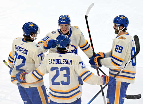 Mar 13, 2022; Hamilton, Ontario, Canada; Buffalo Sabres forward Tage Thompson (72) celebrates with team mates after scoring against the Toronto Maple Leafs in the 2022 Heritage Classic ice hockey game at Tim Hortons Field. Mandatory Credit: Dan Hamilton-USA TODAY Sports