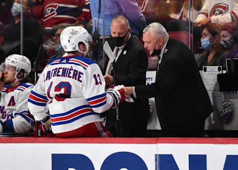 MONTREAL, QC – OCTOBER 16: New York Rangers head coach Gerard Gallant (C) and assistant coach Mike Kelly (R) speak with Alexis Lafrenière #13 during the third period against the Montreal Canadiens at Centre Bell on October 16, 2021 in Montreal, Canada. The New York Rangers defeated the Montreal Canadiens 3-1. (Photo by Minas Panagiotakis/Getty Images)