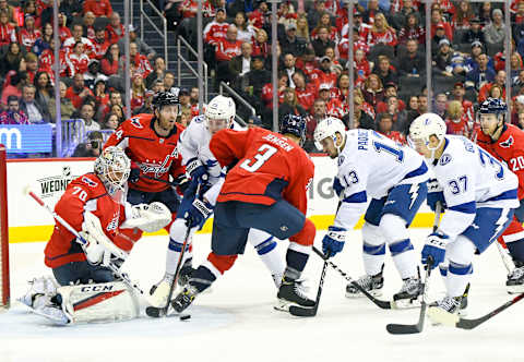 WASHINGTON, DC – MARCH 20: Washington Capitals goal tender Braden Holtby (70) makes a second period save on shot by Tampa Bay Lightning left wing Adam Erne (73) on March 20, 2019, at the Capital One Arena in Washington, D.C. (Photo by Mark Goldman/Icon Sportswire via Getty Images)