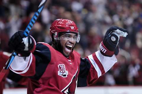 Nov 1, 2016; Glendale, AZ, USA; Arizona Coyotes left wing Anthony Duclair (10) celebrates a goal by left wing Jamie McGinn (88) during the second period against San Jose Sharks at Gila River Arena. Mandatory Credit: Matt Kartozian-USA TODAY Sports