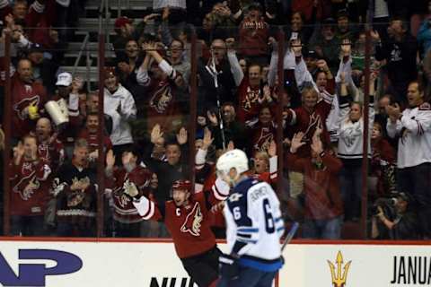 Dec 31, 2015; Glendale, AZ, USA; Arizona Coyotes right wing Shane Doan (19) celebrates a goal against the Winnipeg Jets during the first period at Gila River Arena. The goal by Doan was his 380th of his career and becomes the all-time Coyotes goal-scoring leader. Mandatory Credit: Joe Camporeale-USA TODAY Sports