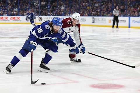 TAMPA, FLORIDA – JUNE 26: Brandon Hagel #38 of the Tampa Bay Lightning skates with the puck as Cale Makar #8 of the Colorado Avalanche defends in the second period of the game in Game Six of the 2022 NHL Stanley Cup Final at Amalie Arena on June 26, 2022 in Tampa, Florida. (Photo by Mike Carlson/Getty Images)