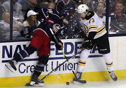 COLUMBUS, OH – MAY 6: Boston Bruins defenseman Charlie McAvoy (73) and Columbus Blue Jackets center Boone Jenner (38) battle for control of the puck during the third period. The Columbus Blue Jackets host the Boston Bruins in Game 6 of the Eastern Conference semifinals at Nationwide Arena in Columbus, OH on May 6, 2019. (Photo by Matthew J. Lee/The Boston Globe via Getty Images)