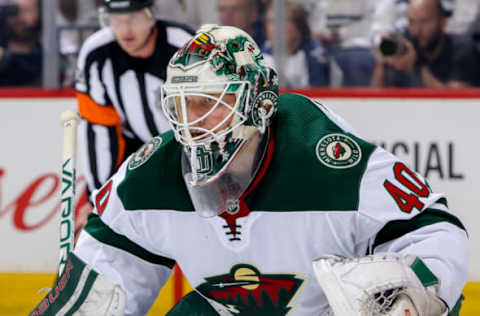 WINNIPEG, MB – APRIL 11: Goaltender Devan Dubnyk #40 of the Minnesota Wild guards the net during first period action against the Winnipeg Jets in Game One of the Western Conference First Round during the 2018 NHL Stanley Cup Playoffs at the Bell MTS Place on April 11, 2018 in Winnipeg, Manitoba, Canada. The Jets defeated the Wild 3-2 to lead the series 1-0. (Photo by Jonathan Kozub/NHLI via Getty Images)