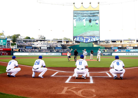 KANSAS CITY, MO – SEPTEMBER 01: The Kansas City Royals Franchise Four, Janie Quisenberry (widow of Dan Quisenberry), Frank White, Bret Saberhagen, and George Brett, throw out the first pitch prior to the game against the Detroit Tigers at Kauffman Stadium on September 1, 2015 in Kansas City, Missouri. (Photo by Jamie Squire/Getty Images)