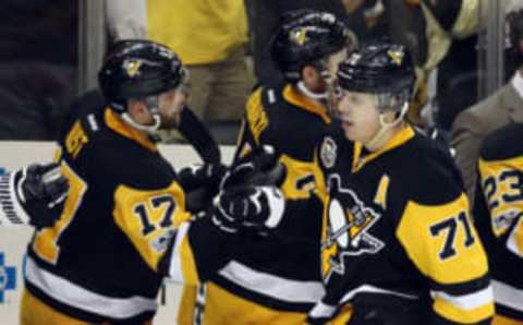 Apr 14, 2017; Pittsburgh, PA, USA; Pittsburgh Penguins center Evgeni Malkin (71) high-fives right wing Bryan Rust (17) after scoring a goal against the Columbus Blue Jackets during the third period in game two of the first round of the 2017 Stanley Cup Playoffs at PPG PAINTS Arena. The Penguins won 4-1. Mandatory Credit: Charles LeClaire-USA TODAY Sports