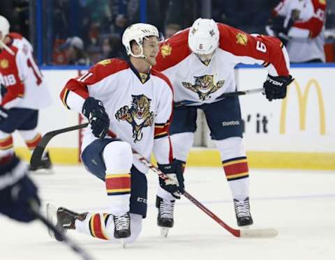 Jan 17, 2016; Tampa, FL, USA;Florida Panthers center Jonathan Huberdeau (11) and defenseman Alex Petrovic (6) talk prior to the game against the Tampa Bay Lightning at Amalie Arena. Mandatory Credit: Kim Klement-USA TODAY Sports