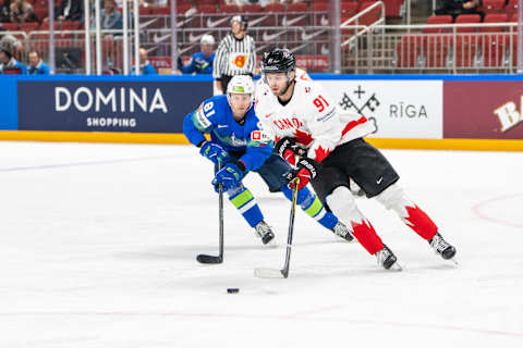 RIGA, LATVIA – MAY 14: Adam Fantilli of Canada regains a puck into the defensive zone during the 2023 IIHF Ice Hockey World Championship Finland – Latvia game between Slovenia and Canada at Arena Riga on May 14, 2023 in Riga, Latvia. (Photo by Jari Pestelacci/Eurasia Sport Images/Getty Images)