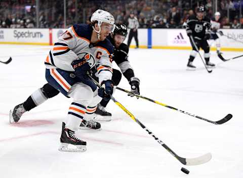 LOS ANGELES, CALIFORNIA – FEBRUARY 23: Connor McDavid #97 of the Edmonton Oilers breaks in on Derek Forbort #24 of the Los Angeles Kings during the third period in a 4-2 Oilers win at Staples Center on February 23, 2020 in Los Angeles, California. (Photo by Harry How/Getty Images)