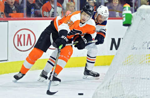 PHILADELPHIA, PENNSYLVANIA – FEBRUARY 02: James van Riemsdyk #25 of the Philadelphia Flyers passes the puck while being defended by Ty Rattie #8 of the Edmonton Oilers at Wells Fargo Center on February 02, 2019 in Philadelphia, Pennsylvania. The Flyers won 5-4 in overtime. (Photo by Drew Hallowell/Getty Images)