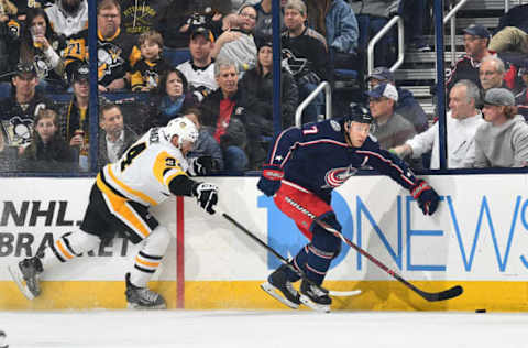 COLUMBUS, OH – APRIL 5: Jack Johnson #7 of the Columbus Blue Jackets skates the puck away from Tom Kuhnhackl #34 of the Pittsburgh Penguins during the first period of a game on April 5, 2018 at Nationwide Arena in Columbus, Ohio. (Photo by Jamie Sabau/NHLI via Getty Images)