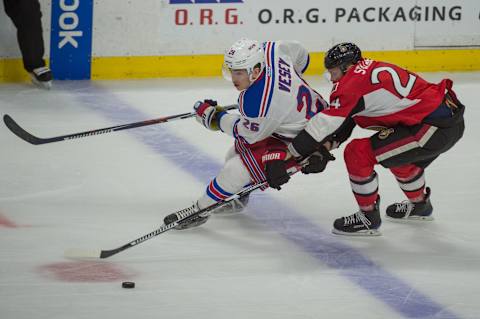 May 6, 2017; Ottawa, Ontario, CAN; New York Rangers left wing Jimmy Vesey (26) and Ottawa Senators left wing Viktor Stalberg (24) battle for the puck in the third period of game five in the second round of the 2017 Stanley Cup Playoffs at Canadian Tire Centre. Mandatory Credit: Marc DesRosiers-USA TODAY Sports