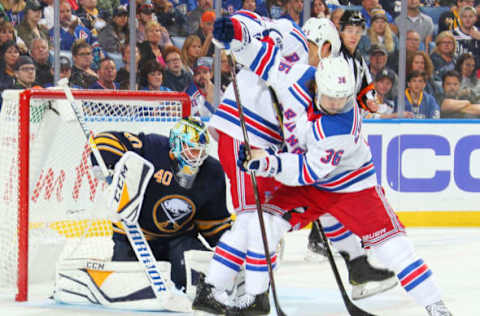 BUFFALO, NY – OCTOBER 6: Carter Hutton #40 of the Buffalo Sabres and Mats Zuccarello #36 of the New York Rangers during an NHL game on October 6, 2018 at KeyBank Center in Buffalo, New York. (Photo by Sara Schmidle/NHLI via Getty Images)