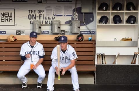 Jun 24, 2017; San Diego, CA, USA; San Diego Padres first baseman Wil Myers (center) and third baseman Cory Spangenberg (15) talk before the game against the Detroit Tigers at Petco Park. Mandatory Credit: Jake Roth-USA TODAY Sports