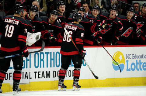 RALEIGH, NC – OCTOBER 11: Teuvo Teravainen #86 of the Carolina Hurricanes is congratulated by teammates after scoring a goal during an NHL game against the New York Islanders on October 11, 2019 at PNC Arena in Raleigh North Carolina. (Photo by Gregg Forwerck/NHLI via Getty Images)