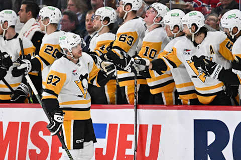 MONTREAL, CANADA – DECEMBER 13: Sidney Crosby #87 of the Pittsburgh Penguins celebrates his goal with teammates on the bench during the second period at the Bell Centre on December 13, 2023 in Montreal, Quebec, Canada. (Photo by Minas Panagiotakis/Getty Images)