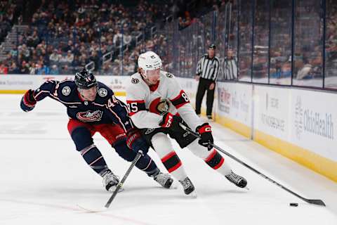 Dec 1, 2023; Columbus, Ohio, USA; Ottawa Senators defenseman Jake Sanderson (85) carries the puck as Columbus Blue Jackets defenseman Erik Gudbranson (44) defends during the first period at Nationwide Arena. Mandatory Credit: Russell LaBounty-USA TODAY Sports