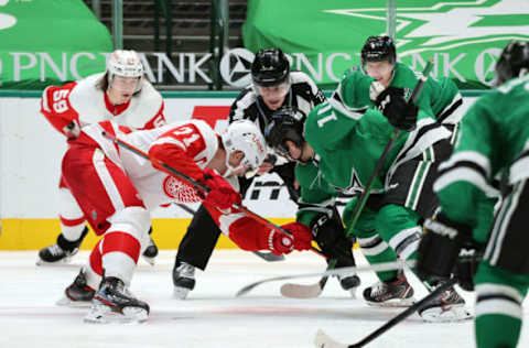 DALLAS, TEXAS – JANUARY 26: Dylan Larkin #71 of the Detroit Red Wings and Ty Dellandrea #10 of the Dallas Stars face-off at American Airlines Center on January 26, 2021 in Dallas, Texas. (Photo by Ronald Martinez/Getty Images)