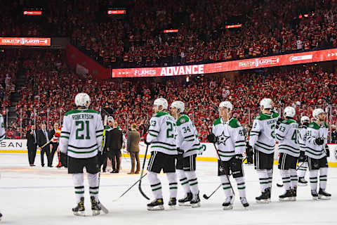 CALGARY, AB – MAY 15: The Dallas Stars stand dejected after losing to the Calgary Flames during the overtime period of Game Seven of the First Round of the 2022 Stanley Cup Playoffs at Scotiabank Saddledome on May 15, 2022 in Calgary, Alberta, Canada. The Flames defeated the Stars 3-2 in overtime. (Photo by Derek Leung/Getty Images)